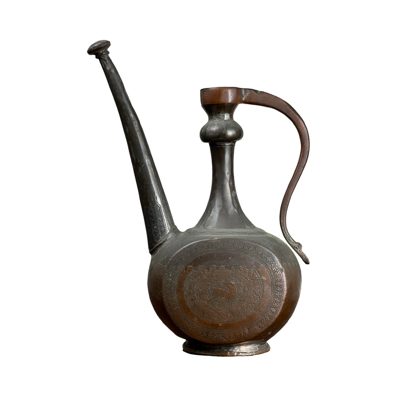 An Antique Qajar Persian Copper Engraved Ewer from the 19th century, featuring a tall form, long spout, rounded body, curved handle, and intricate Islamic engravings, displayed against a plain white background. Brand: Unknown.