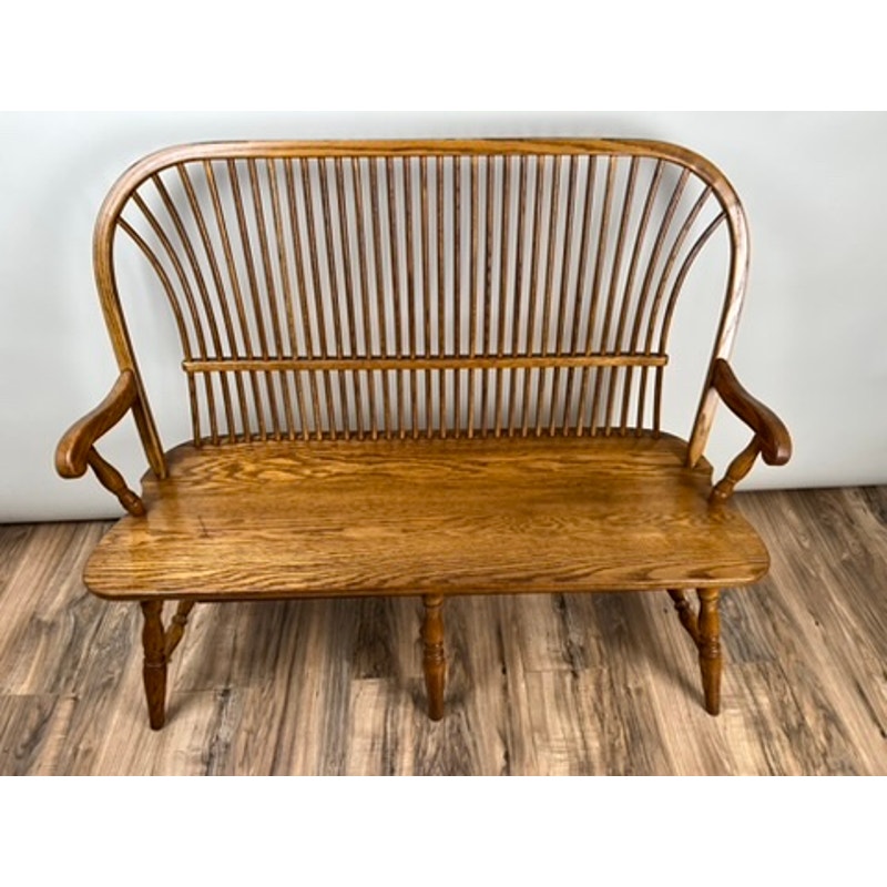 Front view of Amish oak Windsor bench with turned legs