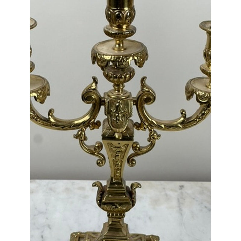 An Antique Pair of Late 19th Century Brass Three Light Candelabra, each with ornate detailing, shown on white marble—a stunning decorative accent for Victorian-inspired home decor. Brand: Unknown.