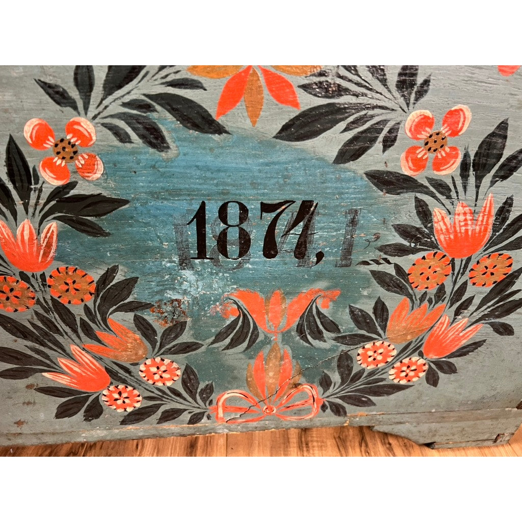 A painted floral design in orange, red, and black with "1841" decorates this Antique Swedish Oak Kista Dowry Chest on a weathered blue surface, evoking classic Swedish style with wooden flooring visible at the bottom. Brand: Unknown.