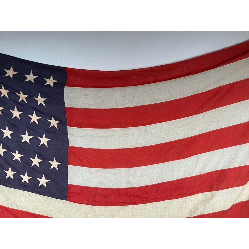 A close-up of an antique 45 star American flag from the Spanish American War era (9’9 x 6), showing some wrinkles and minor signs of aging. Brand: Unknown.