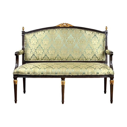 A Vintage Louis XVI Style Settee in green damask upholstery features ornate carvings, gold accents, a high back, and armrests, shown against a white background. Brand: None or unknown.