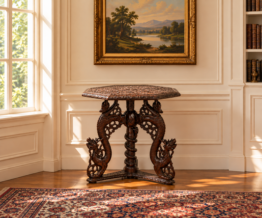 An Antique Burmese Carved Dragon and Serpent Table c. 19th Century with a hexagonal wooden top and intricate carvings of serpents and dragons on the legs and central pedestal.