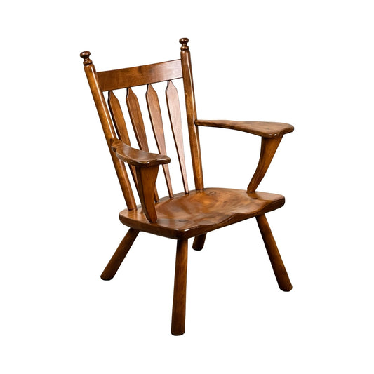 The Cushman Vintage Herman DeVries No. 5-82 Rock Maple Easy Chair showcases a slatted back, angled armrests, and sturdy legs with a polished finish, echoing the timeless charm of Colonial Revival furniture.