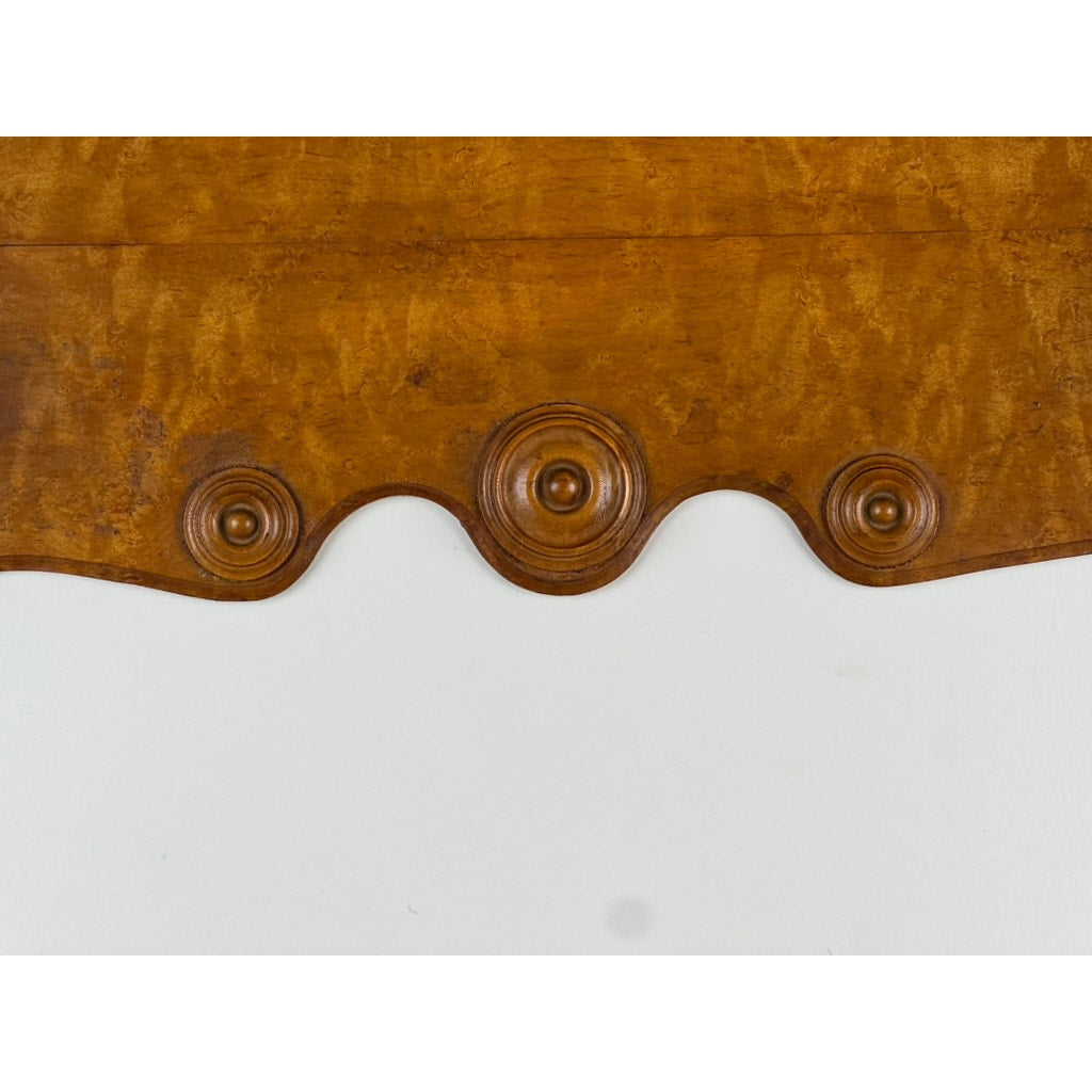 Close-up of an Antique Victorian Birdseye Maple Wall Shelf (late 19th century) featuring a wavy edge and three raised circular carvings, shown against a plain white background. Brand unknown.