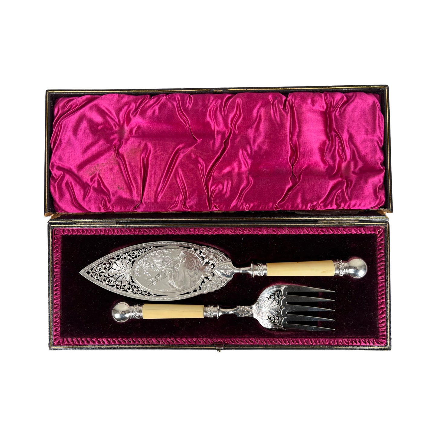 Antique Victorian silver-plated fish serving set, complete with a serving knife and fork featuring ivory-colored handles, presented in an original fitted box lined with deep pink satin and dark velvet.