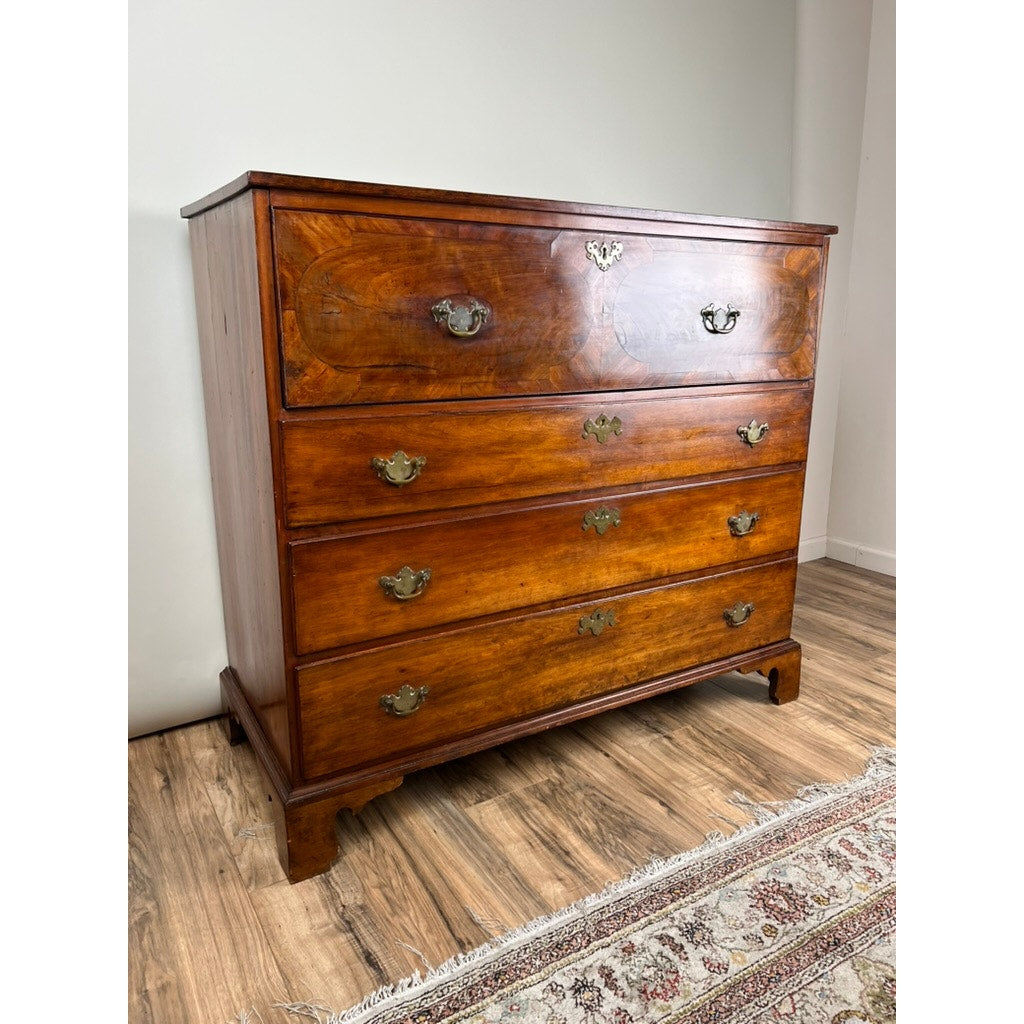The Antique George IV Butlers Secretary (c. Early 19th Century), featuring a polished finish and classic style, adds Regency English charm on wood floors beside a light wall and patterned rug. Brand: None and/or Unknown.