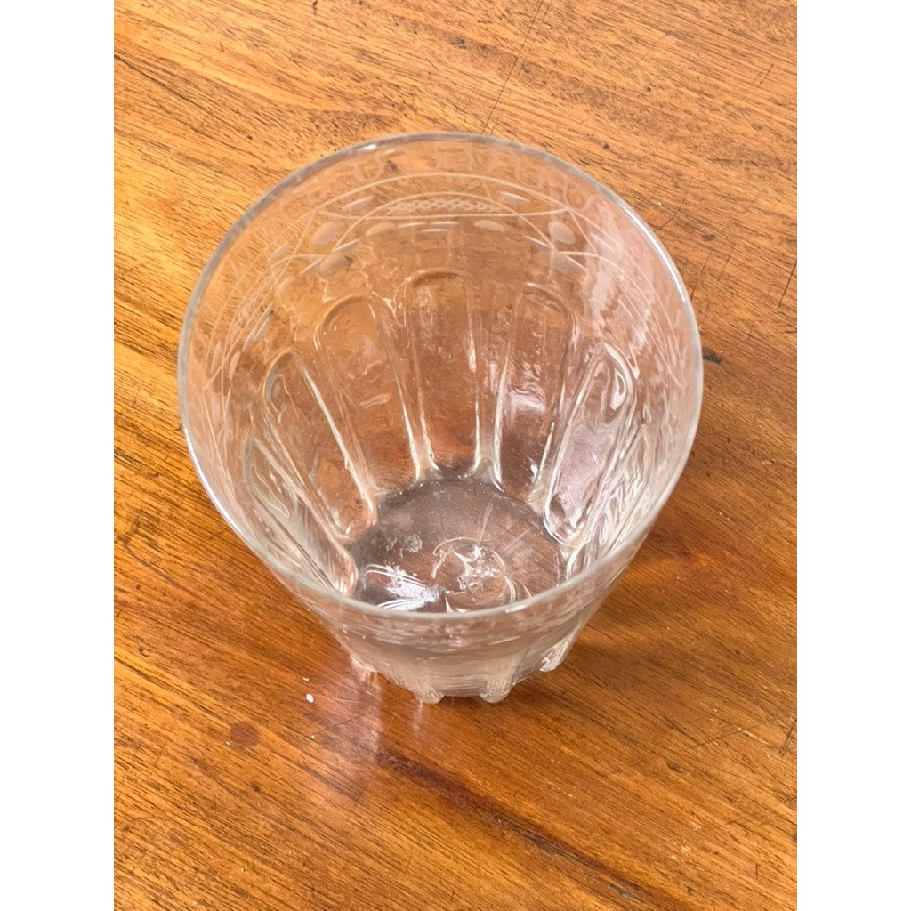 An Attributed Boston & Sandwich wheel-engraved, mold-blown glass table vase (circa 1845–1860) rests on an antique table, its refined form and decorative pattern evoking the elegance of Victorian-era art glass, as seen from above at a slight angle.