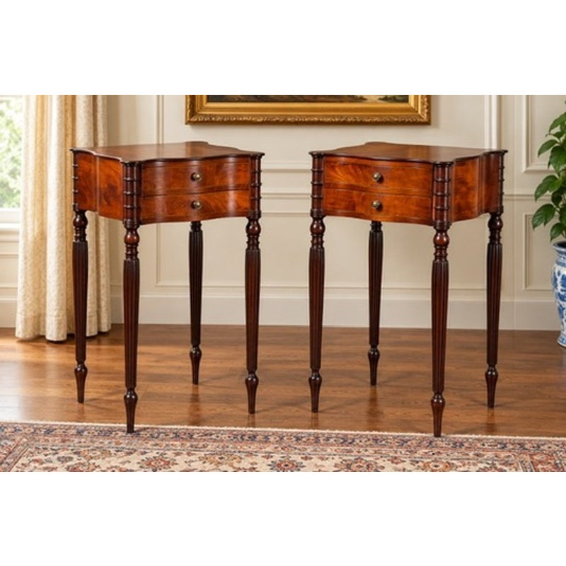 A pair of American Classical Revival Mahogany Two-Drawer Work Tables, each featuring two stacked drawers and slender, fluted legs.