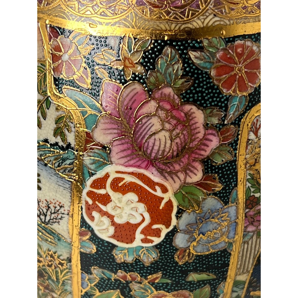 Close-up of a Large Antique Satsuma Porcelain Egg Chinese Export, showcasing intricate floral designs with gold accents and ornate detailing on a dark background—a striking example of collectible Asian export artistry.