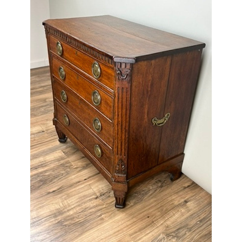 Side profile of antique Louis XVI oak bachelors chest with French provincial form
