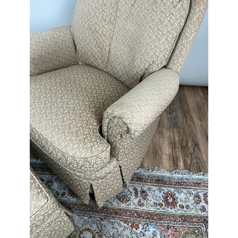 Jessica Charles rocking chair and ottoman in patterned neutral fabric