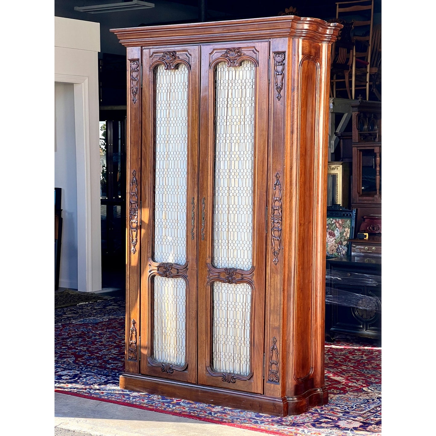 Vintage 20th Century Carved Walnut Louis XIV Style Armoire with Custom Upholstered Interior