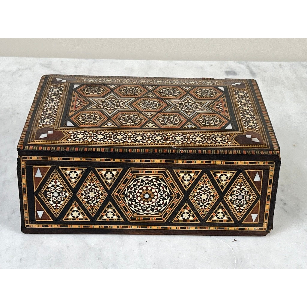 Antique Persian (likely Syrian) Khatam inlaid wood jewelry box, late 19th century, with intricate geometric mosaic patterns—hexagons, triangles, and stars—in brown, black, white, and tan on the lid and sides.