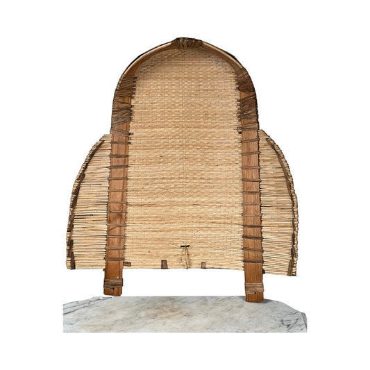 The Vintage Traditional Winnowing Basket is a large, arched structure made of woven natural fibers with wooden supports, designed to stand upright and often used as a vintage decor partition or screen.