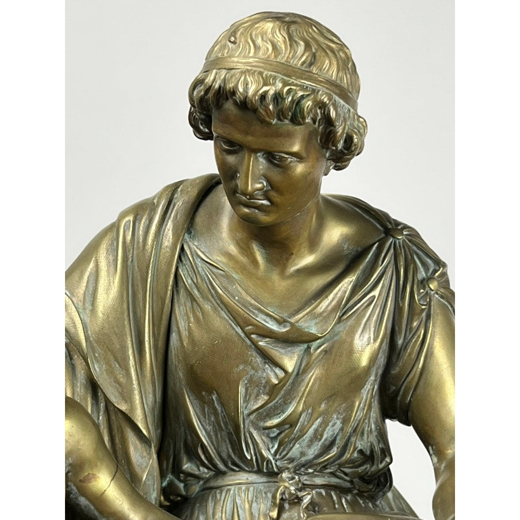 The “Teacher and Pupil” antique bronze sculpture by Louis Charles Janson (signed Ch. Janson, 1865) features a young man with curly hair, draped robe, and headband, evoking the mentor-student relationship in lifelike detail.