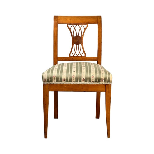 Antique German Biedermeier style cherry side chair, early 20th century, featuring a decorative openwork backrest and a green and beige striped cushioned seat with floral accents. Straight legs evoke classic antique charm. Brand: Unknown.