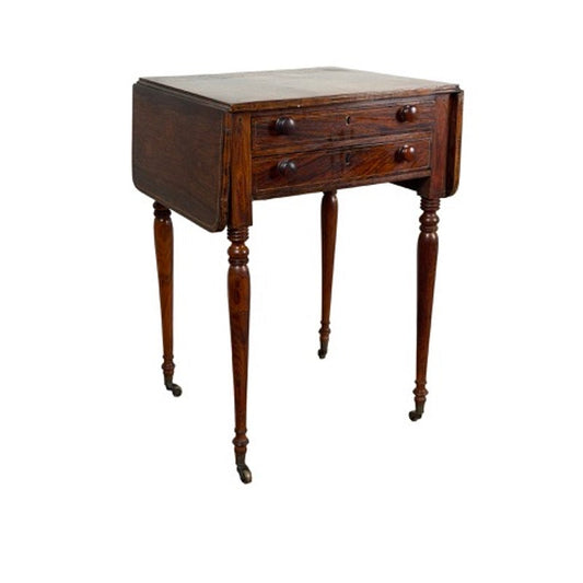 An English Regency Rosewood Two-Drawer Drop-Leaf Work Table with Brass and Satinwood Inlay, circa 1820–1840, featuring two drawers, drop leaves, and tapered legs set on casters.