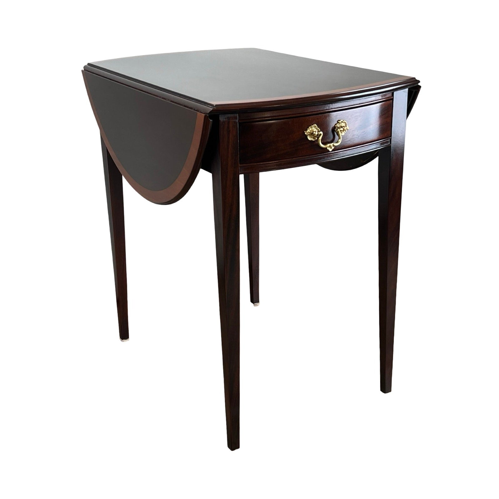 The Stickley Vintage Federal Style Edge Banded Mahogany End Table features slender legs, a single drawer with brass handle, and one leaf extended. Its classic design is perfect for elegant, traditional interiors.