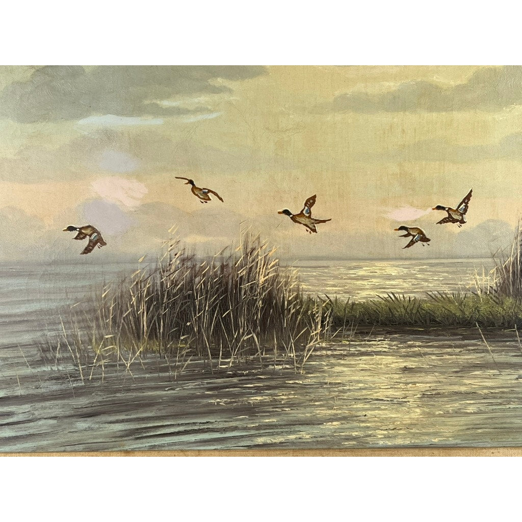 Four ducks fly over a tranquil marsh at sunset in the oil on canvas painting “Mallards Over Marsh” by Joseph Glotzer, featuring tall reeds and gentle clouds for a peaceful landscape scene.