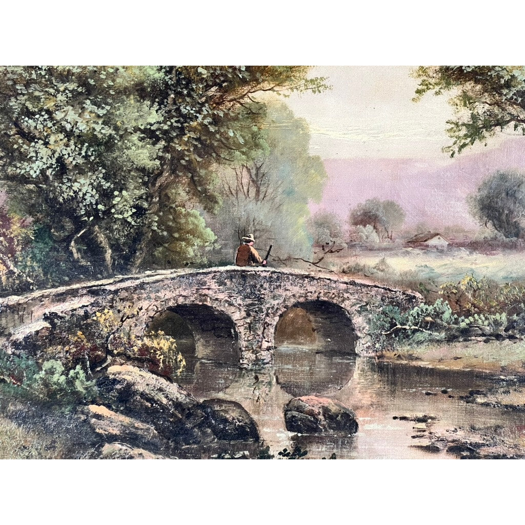 A person in a hat sits on a stone bridge over a calm river with lush greenery, distant houses, and cloudy skies—an idyllic scene from the early 20th century oil on canvas painting “Spectacle Bridge” signed Arthur Davis.