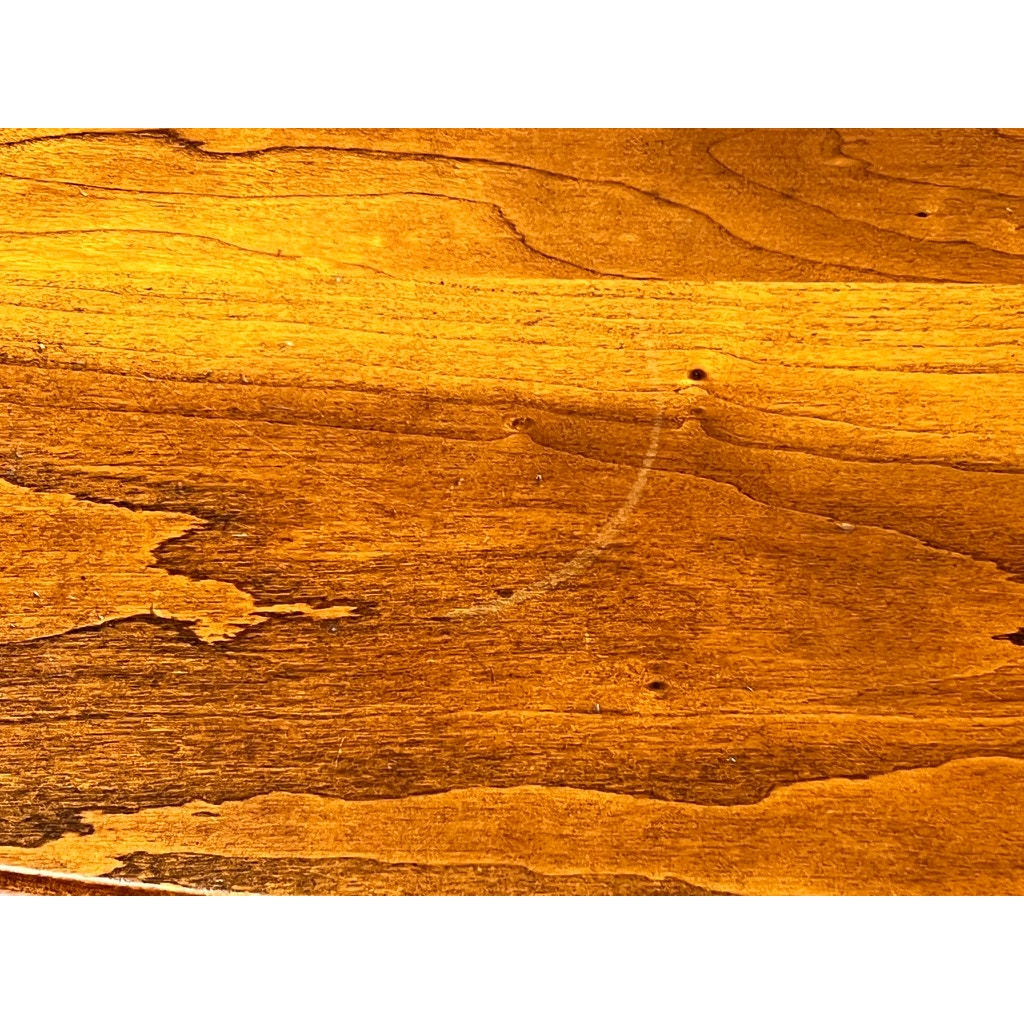 A close-up of a Vintage Solid Cherry Queen Anne Style Coffee Table (attr. Pennsylvania House) shows natural wood grain, small holes, and a faint circular scratch on the surface. Brand: None/Unknown.