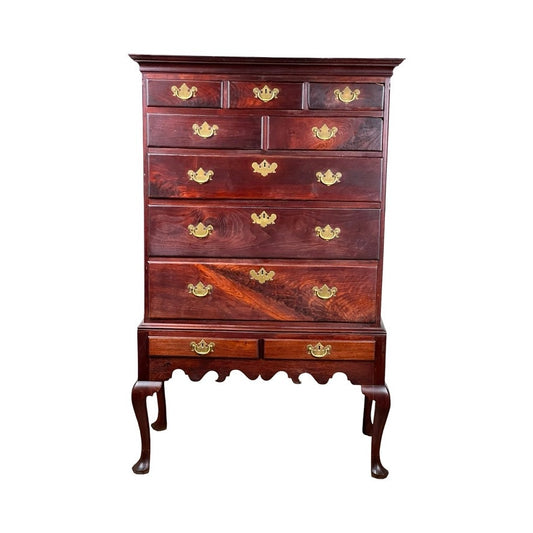 An Antique Queen Anne Walnut Chest on Frame with Drake feet, likely Irish from the late 18th century, featuring multiple drawers and curved legs, is displayed against a white background. Brand: Unknown.