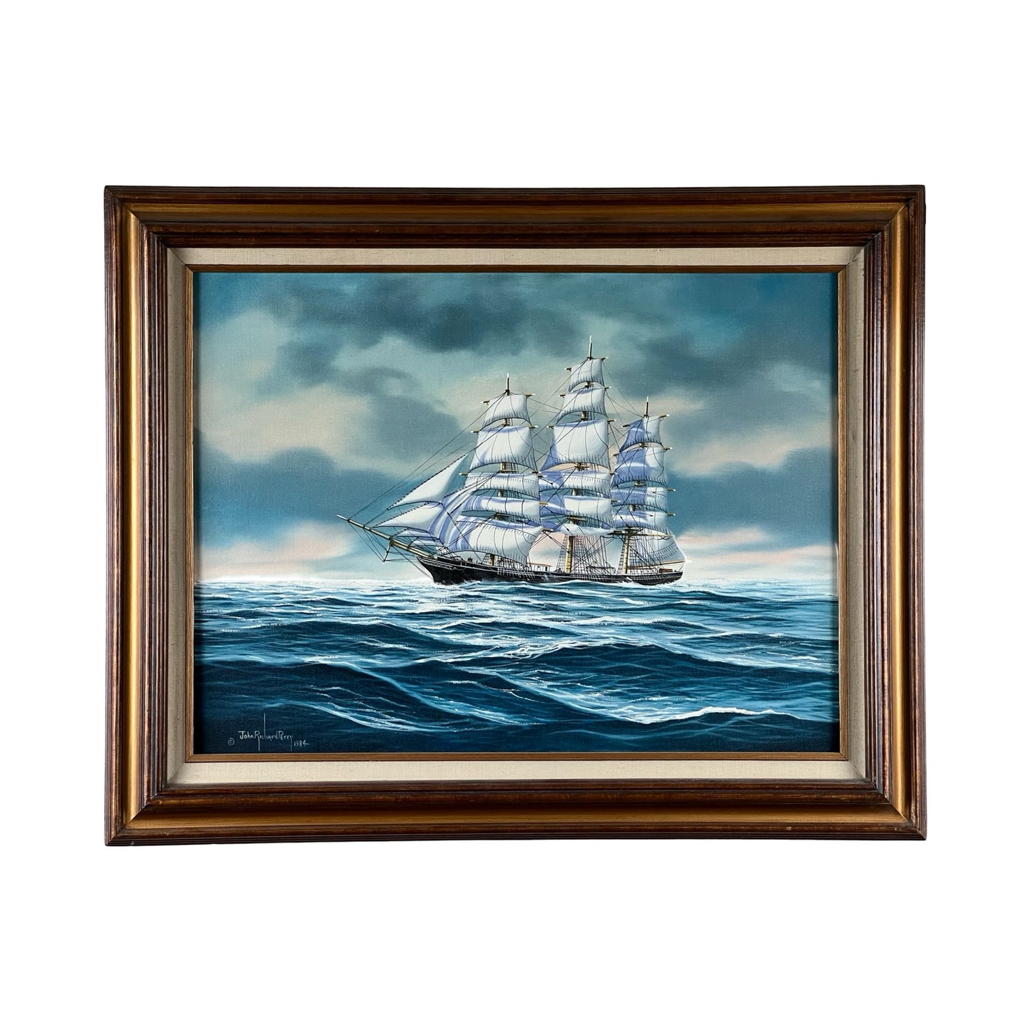“Tall Ship Under Sail” Oil on Canvas by John Richard Perry (1984) features a majestic sailing vessel with white sails on choppy blue water beneath a cloudy sky, set in a wood frame with gold inner border. Brand name unknown.