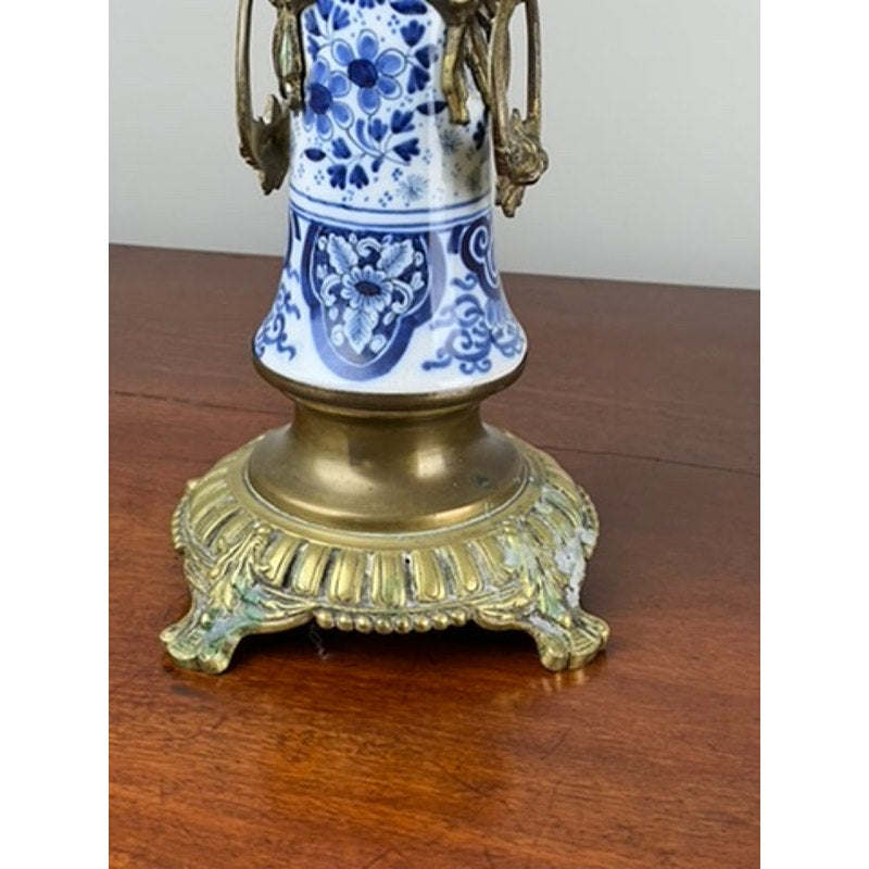 Detail of blue and white Delft decoration on antique candelabra base