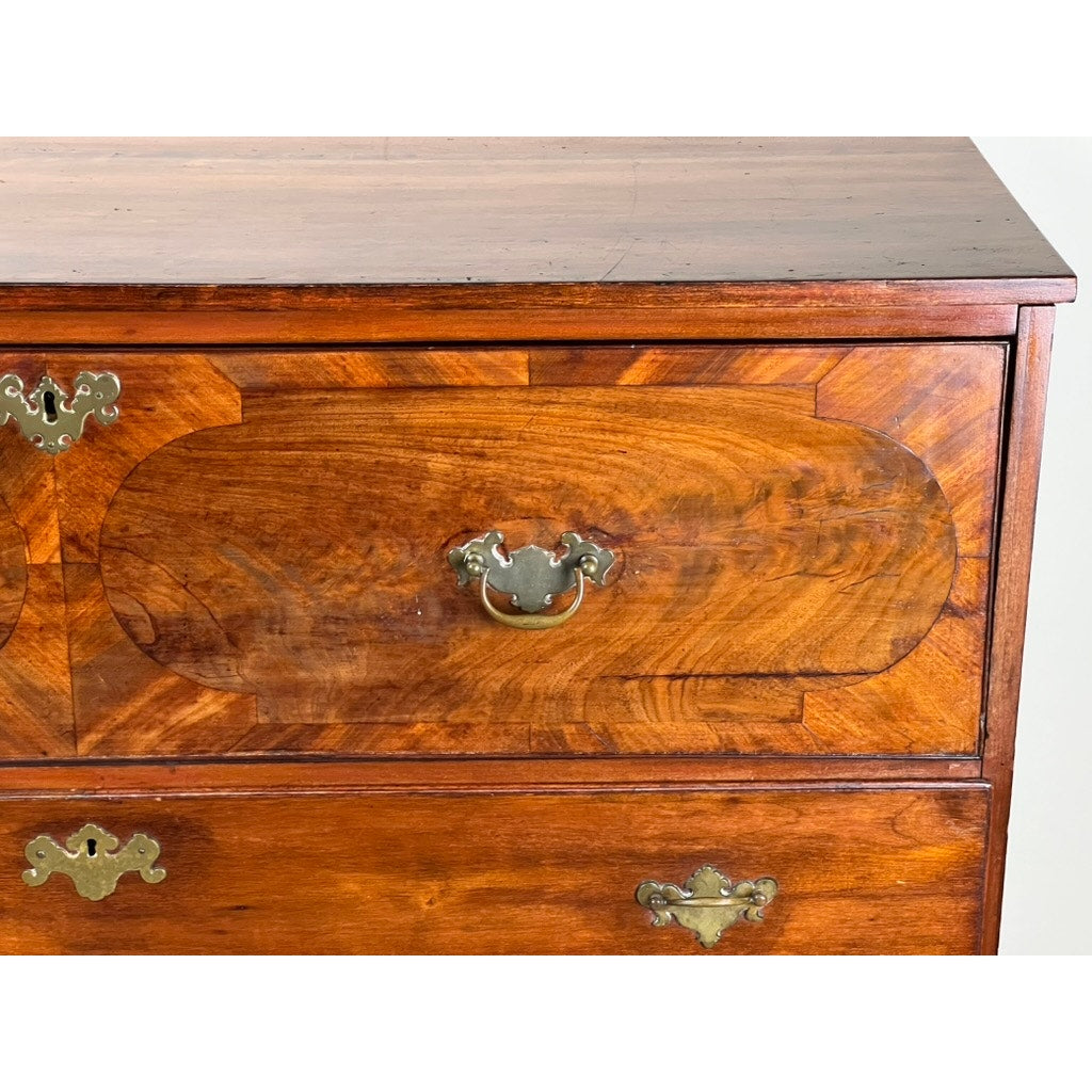 A close-up of the Antique George IV Butlers Secretary, c. Early 19th Century, shows its shiny wood finish, decorative brass handles, and ornate keyhole plates, evoking the elegance of Regency English furniture. Brand: None/Unknown.
