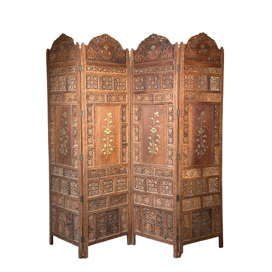 Early 20th Century Anglo-Indian carved teak four-panel screen with applied brass floral decoration. This intricately carved room divider features each panel adorned with ornate detailing and a central floral motif, while the tops of the panels are accented by graceful decorative arches.