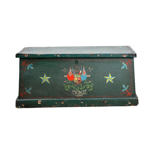 Antique Paint Decorated English Sea Chest, late 19th century, green with yellow stars, red/blue floral accents, and a central crest. Visible wear and chipped edges give it the authentic charm of an old maritime trunk.
