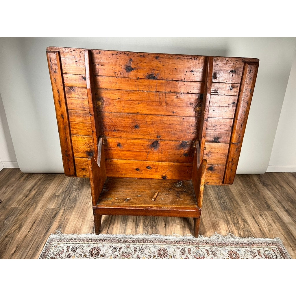 An Antique Country Pine Hutch Table with a six plank top, c. 18th century, sits on a rug over a wood floor. The table features visible knots and marks that highlight its age and country charm. Brand is unknown.
