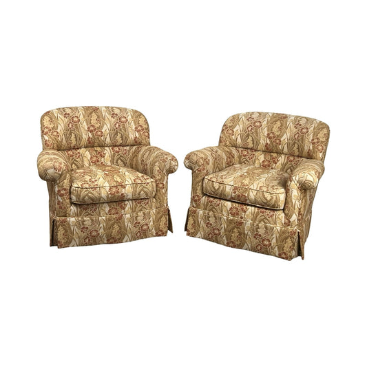 Pair of vintage upholstered club chairs, one swivel and one fixed