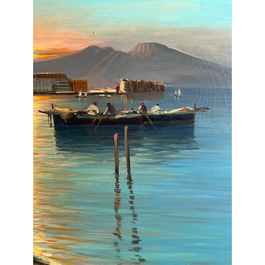 The oil on canvas “Naples Harbor” (28 x 52), signed lower left by C. Ciappa, depicts people in a small boat at sunset with distant sailboats, shoreline buildings, and a mountain in the serene coastal scene.