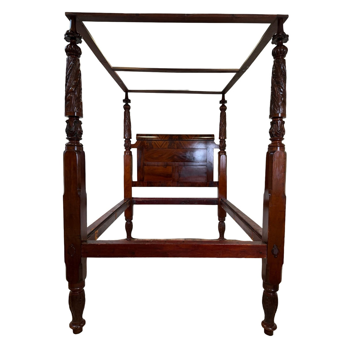 American Classical Carved Mahogany Four-Poster Tester Bed, possibly New York circa 1825–1840, featuring intricately carved columns and a headboard.