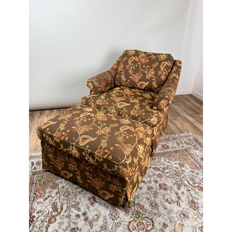 Custom upholstered vintage club chair and ottoman with skirted base