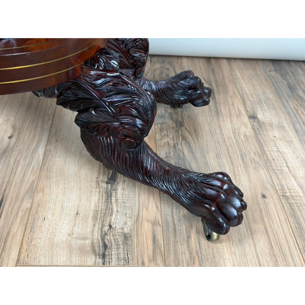 A dark mahogany carved paw foot with a metal caster from an American Classical Carved Mahogany Dressing Table with Original Mirror, Probably New York, c. 1825–1835.