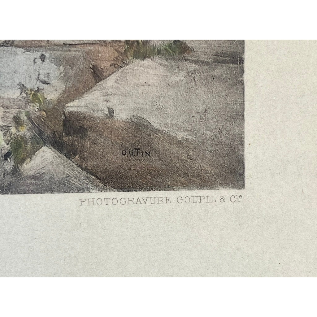 A close-up of the 1897 antique Goupil photogravure “Premier Chapitre” after François-Edmond Outin shows its textured, off-white background with “Goupil & Cie” and “OUTIN” visible, plus part of a painted stone surface above.